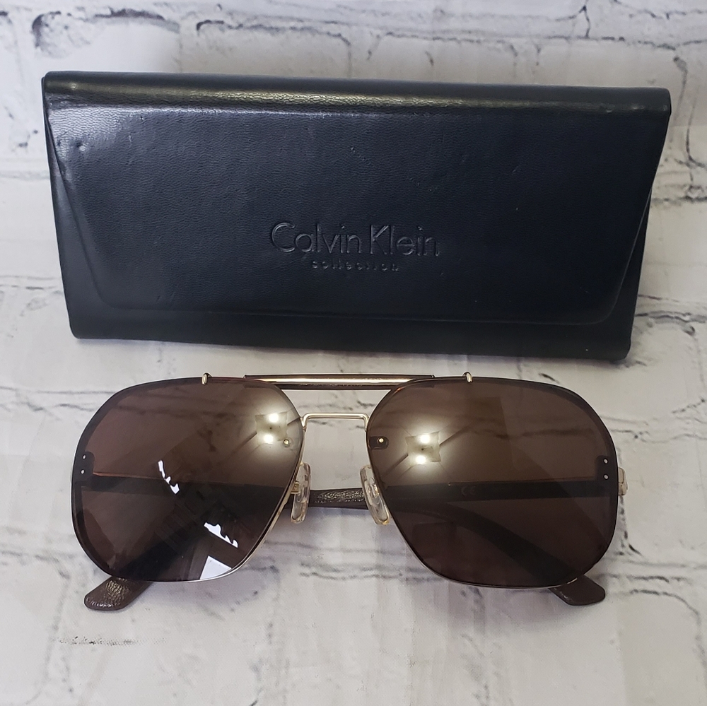 Calvin Klein Sunglasses w/ matching case and cleansing cloth